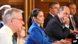 FILE - Britain's Home Secretary Priti Patel attends a Cabinet meeting of senior government ministers at the Foreign and Commonwealth Office FCO in London, Sept. 1, 2020.