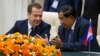 Russian Prime Minister Dmitry Medvedev listens to Cambodian Prime Minister Hun Sen, right, during documents signing ceremony in Phnom Penh, Cambodia on Tuesday, Nov. 24, 2015. (Dmitry Astakhov/Sputnik, Government Pool Photo via AP)