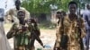FILE - South Sudanese government soldiers patrol in Bentiu town, South Sudan, June 24, 2015. The country's conflict has killed tens of thousands of people since it started in December 2013.