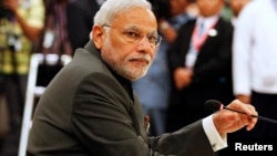 Indian Prime Minister Narendra Modi attends the 12th ASEAN-India Summit during the 25th ASEAN Summit in Naypyitaw, Myanmar, Nov. 12, 2014.