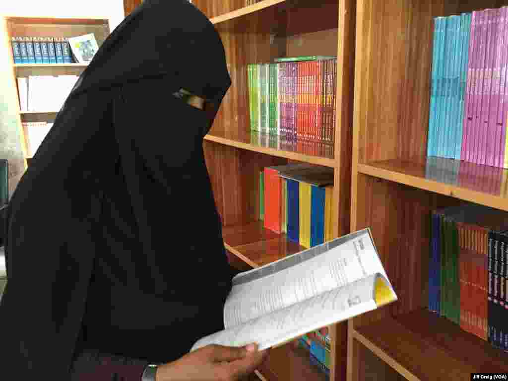 A Yemeni refugee browses the book selections at the Peaceful Coexistence Center, in Hargeisa, Somaliland, April 3, 2016.