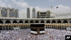Muslim pilgrims circumambulate around the Kaaba, the cubic building at the Grand Mosque, ahead of the Hajj pilgrimage in the Muslim holy city of Mecca, Saudi Arabia, Aug. 8, 2019.
