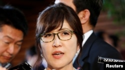 Japan's new defense minister Tomomi Inada talks to reporters at Prime Minister Shinzo Abe's official residence in Tokyo, August 3, 2016.