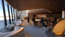 Virgin Galactic employees gather at the coffee bar that serves as the heart of the company's social hub where they will meet with customers and their families at Spaceport America. (AP Photos/Susan Montoya Bryan)