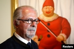 Fernando Botero attends the opening of his exhibition "The Circus" in Medellin, Colombia, Feb. 2, 2015. A Botero sculpture, "Man on a Horse," sold for $1.82 million, Tuesday, Nov. 23, 2016.
