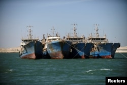 Chinese fishing vessels are seen moored off the coast of Nouadhibou, Mauritania, April 14, 2018.
