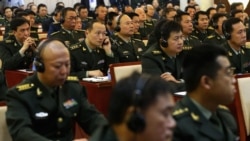 FILE - Students of the National Defense University listen as US Secretary of Defense Chuck Hagel gives a speech at the university in Beijing on April 8, 2014. (Alex Wong/Pool/AFP)