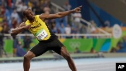 Usain Bolt from Jamaica celebrates winning the gold medal in the men's 200-meter final during the athletics competitions of the 2016 Summer Olympics at the Olympic stadium in Rio de Janeiro, Brazil, Thursday, Aug. 18, 2016.