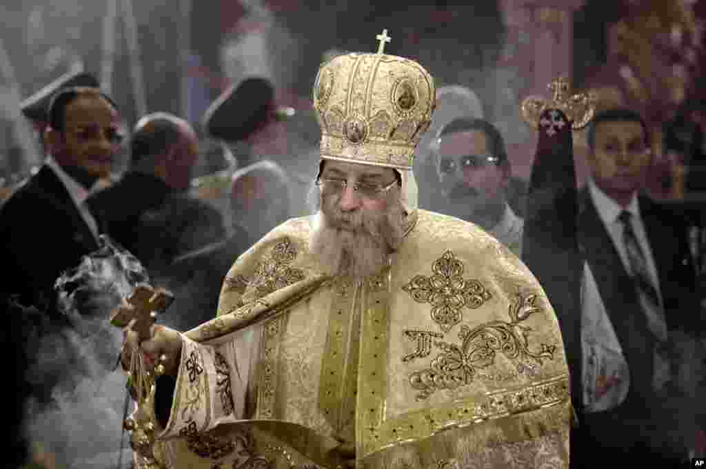 Egyptian Coptic Pope Tawadros II leads prayers during the Easter Eve service at St. Mark's Cathedral in Cairo, Egypt, April 15, 2017.