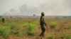 A soldier from the United Nations Mission in South Sudan (UNMISS) Ethiopian division patrols the perimeter of protection of civilians (POC) site in Juba, South Sudan, Dec. 5, 2016. (J. Craig/VOA)