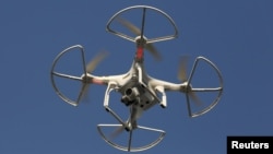 FILE - The use of drones "will help us to define the boundaries of plots of land on the ground with great accuracy," said Samuel Msaki of Tanzania's Ministry of Lands, Housing and Human Settlements Development.