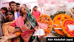 A relative of a victim of the Rana Plaza collapse cries during a memorial ceremony marking the third anniversary of the collapse of the eighty-story building in Dhaka, Bangladesh, 24 April 2016. 