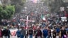 Migrantes participan en una caravana hacia la frontera con Estados Unidos en Tapachula, estado de Chiapas, México, el 24 de diciembre de 2023. 