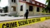 FILE PHOTO: A police crime scene tape is seen in front of St. Francis Catholic Church where gunmen attacked worshippers during a Sunday mass service in Owo, Ondo, Nigeria, June 6, 2022
