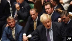 Britain's Prime Minister Boris Johnson speaks in the House of Commons following the debate for the EU Withdrawal Agreement Bill, in London, Oct. 22, 2019.
