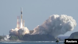FILE - H-IIA rocket carrying the national space agency's moon lander is launched at Tanegashima Space Center in Japan ion Sept. 7, 2023. Japan announced Feb. 13, 2024, it will postpone the launch of the H3 rocket scheduled for this week. (Kyodo/via REUTERS)