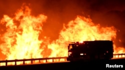 A fire truck is pictured, as a wind-driven wildfire burns in Canyon Country, north of Los Angeles, California, Oct. 25, 2019.