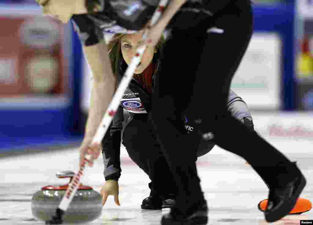 Canada's skip Rachel Homan delivers a stone during her draw against Germany at the World Women's Curling Championships in Saint John, New Brunswick, Canada.