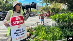 Estella Fontanilla, a housekeeper on strike from Hilton Hawaiian Village, leads hotel workers in strike chants in Honolulu, Hawaii, Sept. 24, 2024. More than 4,300 hotel workers are now on strike at Hilton, Hyatt, and Marriott hotels in Hawaii, California, and Washington state.