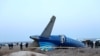 Bagian dari pesawat Azerbaijan Airlines yang tersisa di lokasi jatuhnya pesawat tersebut di dekat Kota Aktau, Kazakhstan, pada 25 Desember 2024. (Foto: Administration of Mangystau region/Handout via Reuters)
