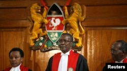 FILE - Kenya's Supreme Court Chief Justice David Maraga, center, presides before delivering the ruling declaring the presidential election invalid, Sept. 1, 2017.