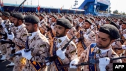 Members of Iran's Revolutionary Guards Corps (IRGC) march during the annual military parade marking the anniversary of the outbreak of the devastating 1980-1988 war with Saddam Hussein's Iraq, in the capital Tehran, Sept. 22, 2018. 
