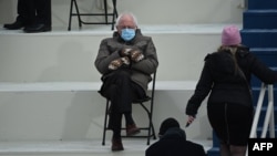 Senator Bernie Sanders sits in the bleachers on Capitol Hill before Joe Biden is sworn in as the 46th U.S. president, in Washington, Jan. 20, 2021.