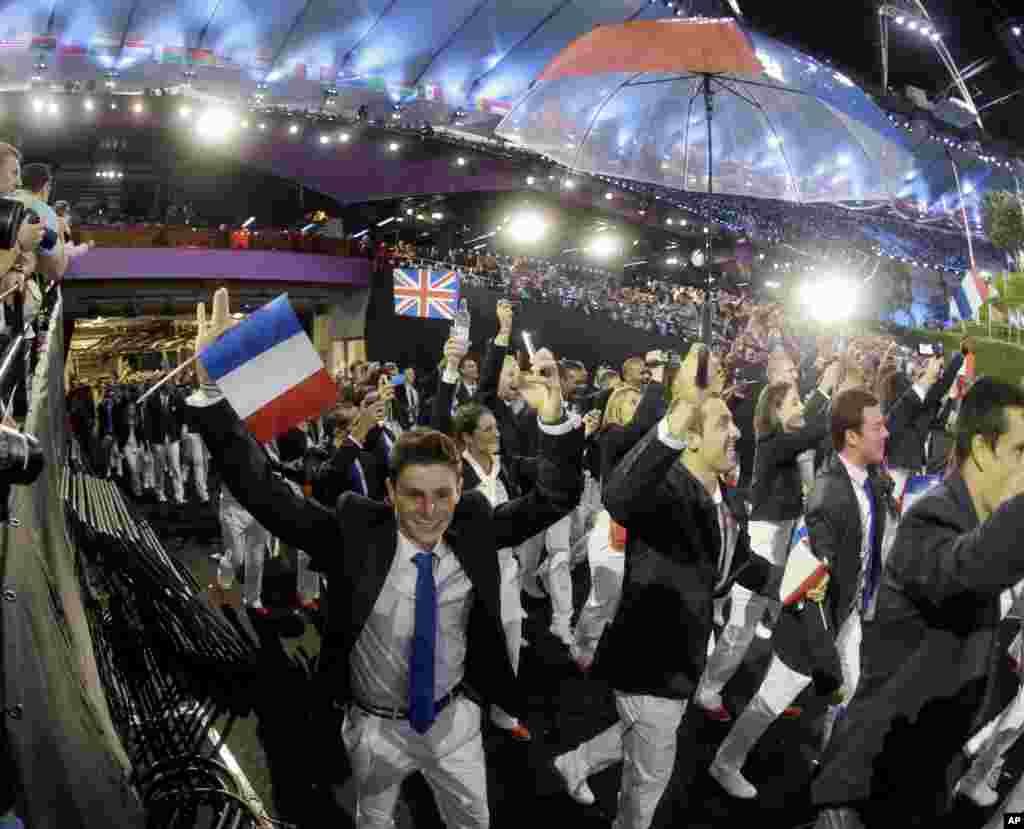 France's Olympic team arrives during the Opening Ceremony at the 2012 Summer Olympics, July 27, 2012, in London.