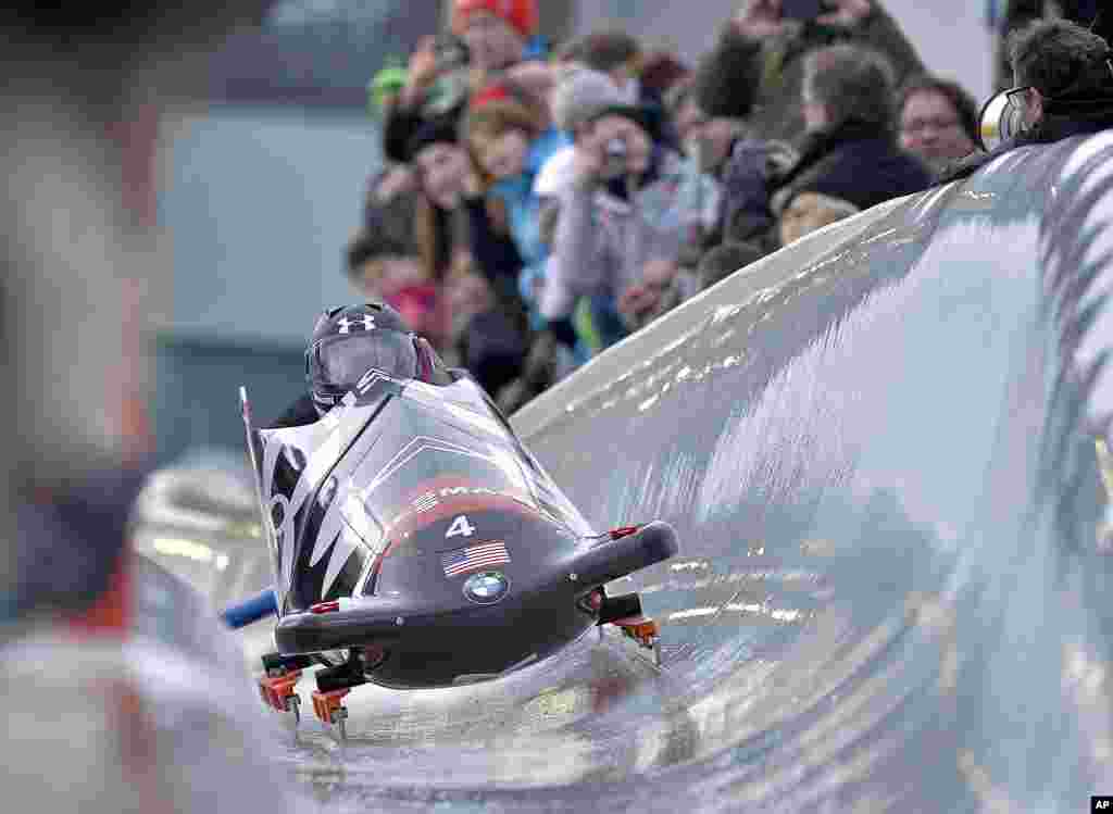 Steven Holcomb, front, and Steven Langton from the U.S. speed down the run during the two-man bobsled World Cup in Winterberg, Germany.