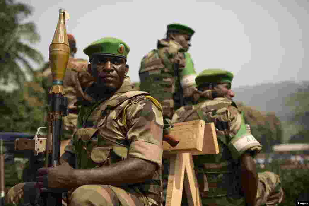 Soldiers from the AU peacekeeping mission prepare to leave at the end of a speech given by Alexandre Nguendet, the head of Central African Republic's transitional assembly at the Gendarmerie headquarters in Bangui on Jan. 13, 2014.