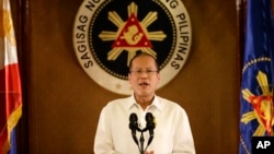 Philippine President Benigno Aquino III addresses the nation in a live broadcast from the Presidential Palace in Manila, July 14, 2014. 