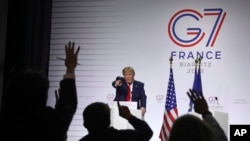 President Donald Trump takes questions during a press conference on the third and final day of the G-7 summit in Biarritz, France, Aug. 26, 2019.