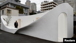 A person looks around a public toilet during a Tokyo Toilet Shuttle Tour, at Shibuya ward, in Tokyo, Japan April 4, 2024. (REUTERS/Kim Kyung-Hoon)