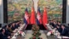 Cambodia's Prime Minister Hun Sen (2nd L) and China's President Xi Jinping (R) attend a meeting at Xijiao Hotel in Shanghai, May 18, 2014. 
