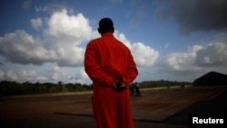 A Petrobras worker stands at the Oiapoque airport, near the mouth of the Amazon in Oiapoque, State of Amapa, Brazil, March 20, 2024. (REUTERS/Adriano Machado)
