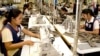 FILE: Cambodian garment workers sew clothes in a factory in Phnom Penh, Cambodia, Aug. 4, 2007. 