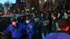 Des agents de police de New York dans le quartier de Brooklyn à New York, mardi 28 avril 2020. (Todd Maisel via AP)