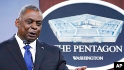 FILE - Defense Secretary Lloyd Austin speaks during a briefing at the Pentagon in Washington, May 6, 2021. 