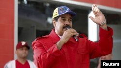 Venezuela's President Nicolas Maduro speaks during a meeting with supporters in the Petare slum district of Caracas, ahead of impending elections in the country, Dec. 1, 2015.