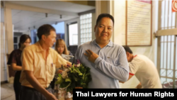 Siraphop Kornaroot poses for a photo after his release from jail, June 11, 2019. The three-finger salute, adopted from the Hunger Games movies, has come to symbolize resistance to military rule in Thailand. (Photo: Thai Lawyers for Human Rights)