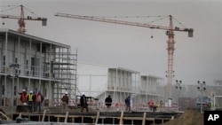 Construction workers walk at the area under construction at the US embassy in Kabul, Afghanistan (File Photo)