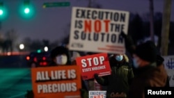 FILE - Activists protest the death penalty at the United States Penitentiary in Terre Haute, Indiana, Jan. 12, 2021.