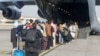 FILE - Evacuees assemble before boarding a C-17 Globemaster III during an evacuation at Hamid Karzai International Airport, Aug. 18, 2021. (U.S. Marine Corps/Lance Cpl. Nicholas Guevara/Handout via Reuters)