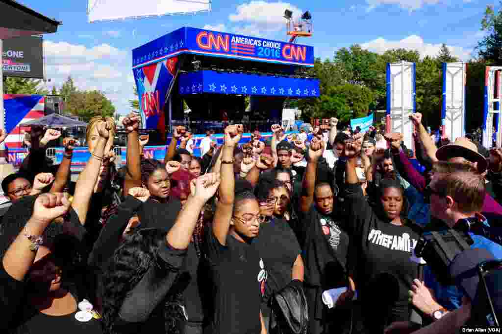 Members of the Black Lives Matter protest movement speak with reporters on the Hofstra University campus ahead of Monday night's first presidential debate (B. Allen/VOA)