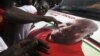 National Democratic Congress (NDC) party supporters celebrate the victory of their candidate, John Dramani Mahama, in Accra, December 9, 2012.