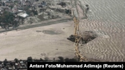 An aerial view shows a bridge damaged by an earthquake and tsunami in Palu, Central Sulawesi, Indonesia, Sept. 29, 2018. 