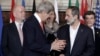 U.S. Secretary of State John Kerry, second from left, talks to Syria opposition coalition president Moaz al-Khatib, second from right, at conference boosting global aid to rebel fighters, Thursday, Feb. 28, 2013. (AP)