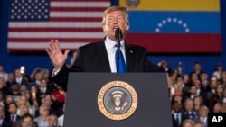 President Donald Trump speaks to a Venezuelan American community at Florida Ocean Bank Convocation Center at Florida International University in Miami, Florida, Feb. 18, 2019.