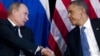 President Barack Obama shakes hands with Russian President Vladimir Putin, G20 Summit, Los Cabos, Mexico, June 18, 2012.