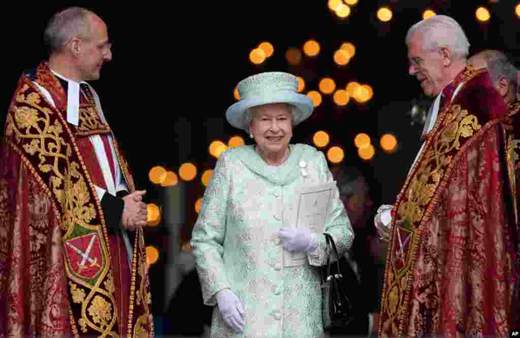 The Queen departs St Paul's Cathedral with the Dean of St Paul's David Ison, left, following a service of thanksgiving on the last day of the Queen's Diamond Jubilee celebrations.